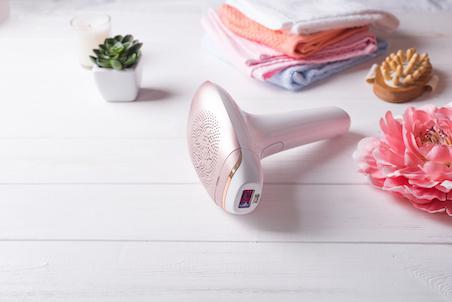 A laser hair removal device flatlay