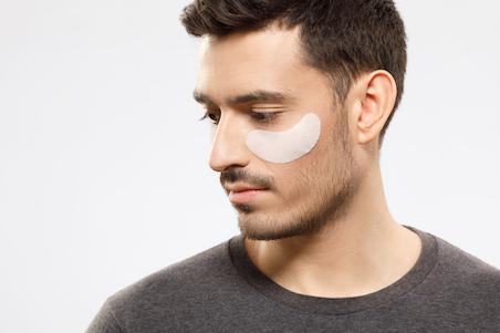 man wearing under eye mask