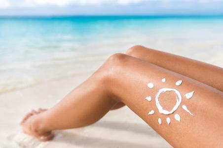photo of legs with a sunscreen on