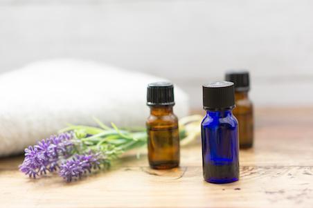 Three small bottles on wooden table