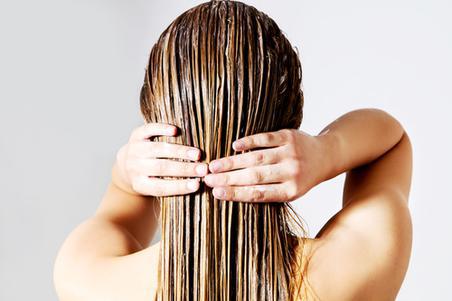 Woman with wet hair and hair mask