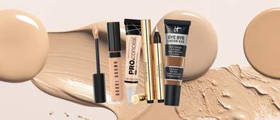 4 different concealers on a background of face makeup swatches