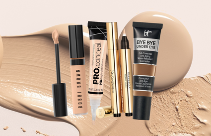 4 different concealers on a background of face makeup swatches