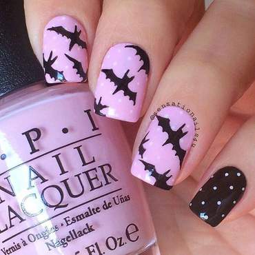 Pink and black bat nails