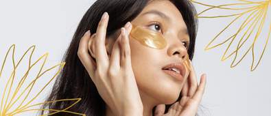 Woman wearing gold undereye masks