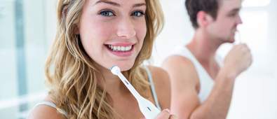Couple brushing teeth