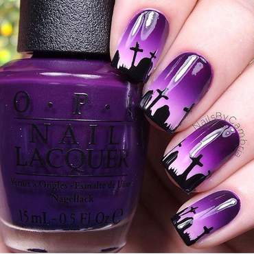 Nails painted with a graveyard design