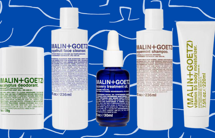 Malin + Goetz products on blue and white background