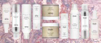 OUAI products on pink marble background