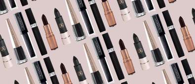 Black lipsticks on brown background