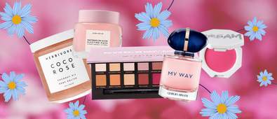 Five cosmetic products on pink background with blue flowers