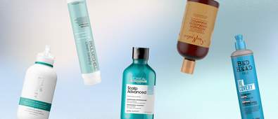 different shampoo bottles on a blue and white gradient background