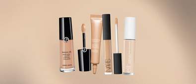 four different concealers with a beige gradient background