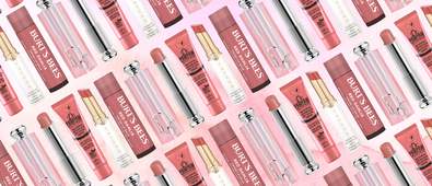 different pink lip balms on a pink watercolour background