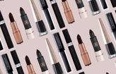 Black lipsticks on brown background