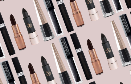Black lipsticks on brown background