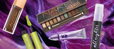 Five Urban Decay products on purple background