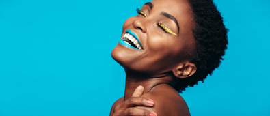 black woman with vibrant makeup