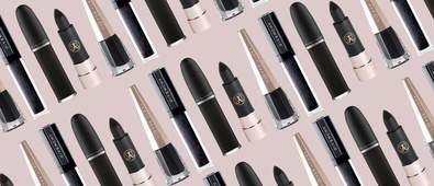 black lipsticks on pink background