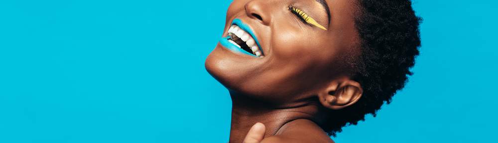 black woman with vibrant makeup