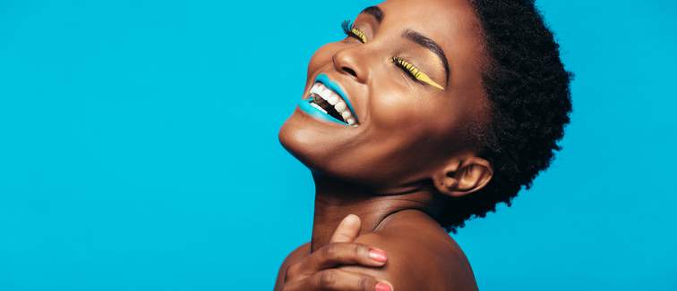 black woman with vibrant makeup