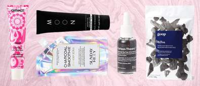 charcoal beauty products on pink background