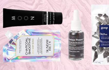 charcoal beauty products on pink background
