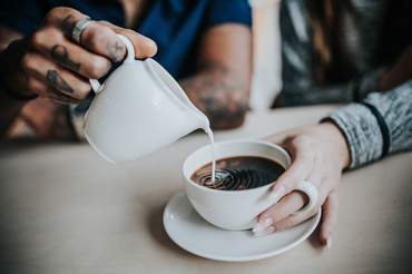 Two friends pouring milk into coffee. Image by <a href="https://pixabay.com/users/Pexels-2286921/?utm_source=link-attribution&utm_medium=referral&utm_campaign=image&utm_content=1867429">Pexels</a> from <a href="https://pixabay.com/?utm_source=