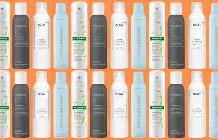 Dry shampoo bottles on orange background