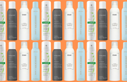 Dry shampoo bottles on orange background
