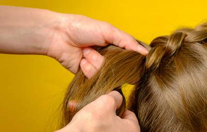Hair plaiting brown hair
