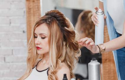 model getting her hair styled