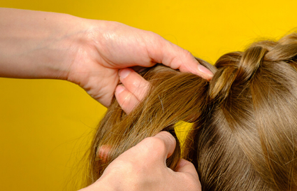 Hair plaiting brown hair