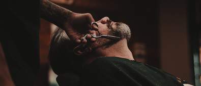 Barber shaving man