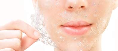 lady peeling off glitter face mask
