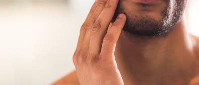 Man caring for patchy beard