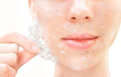 lady peeling off glitter face mask