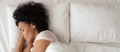 Women lying in bed asleep
