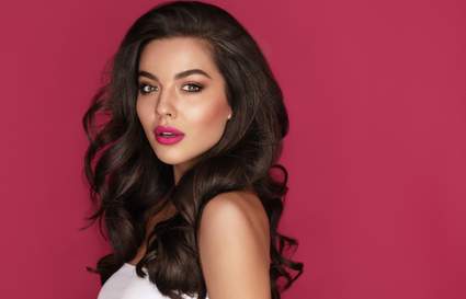 Brunette haired Woman Portrait with big, bouncy hair