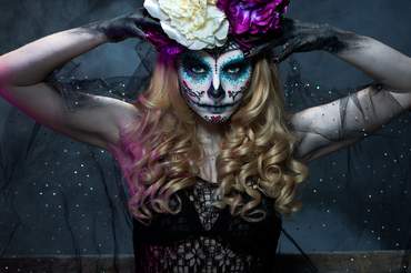 woman with curly hair wearing halloween costume