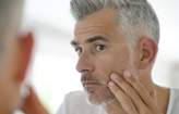 Middle-Aged Man Applying Treatment