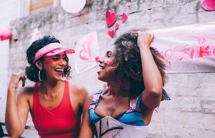 Two female best friends laughing
