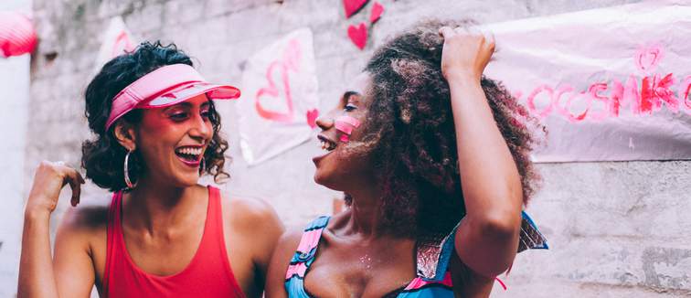 Two female best friends laughing